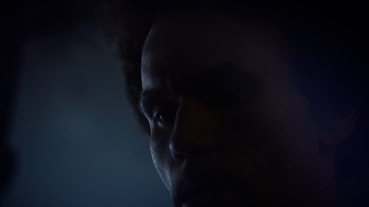 Still from a cinematic fitness trailer shot on a gym floor